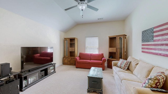 living area with a ceiling fan, vaulted ceiling, carpet, and visible vents