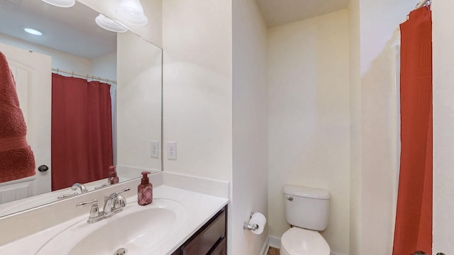 full bathroom featuring vanity and toilet