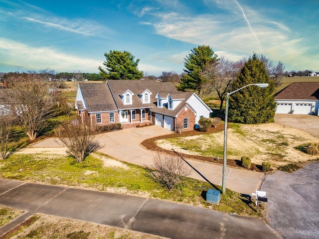 view of front of home featuring concrete driveway and an attached garage