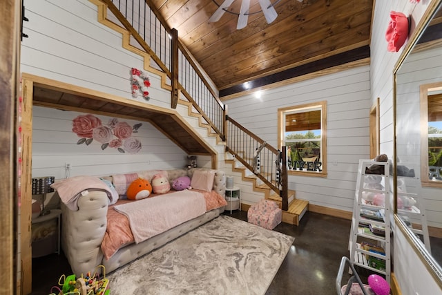 bedroom featuring wood ceiling and finished concrete floors