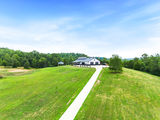 view of yard featuring a gazebo and a rural view