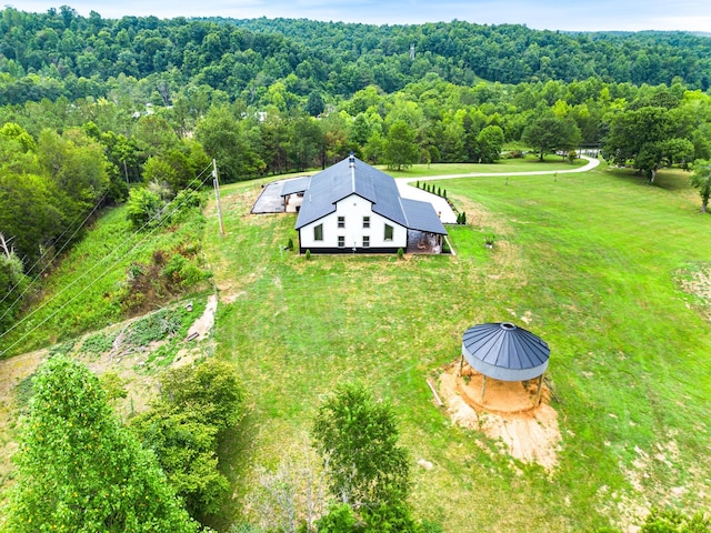 bird's eye view featuring a wooded view