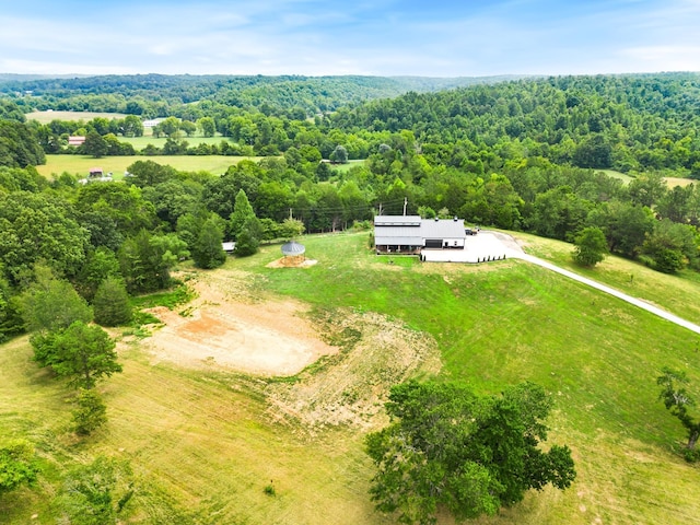 aerial view with a forest view and a rural view