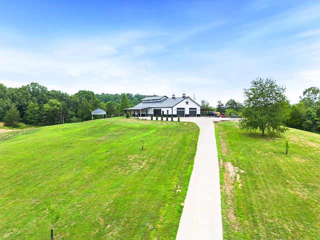 view of front facade featuring a gazebo and a front yard