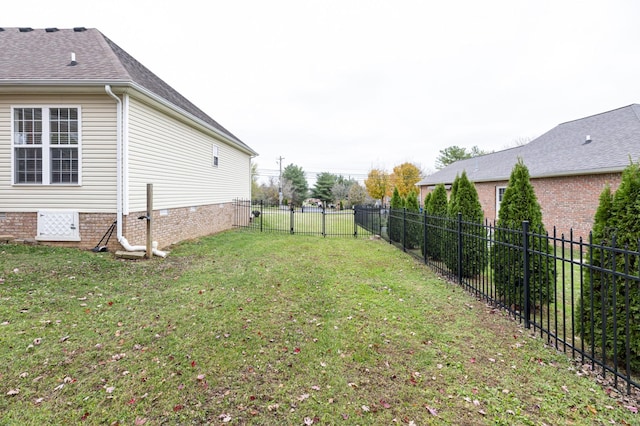 view of yard with a fenced backyard