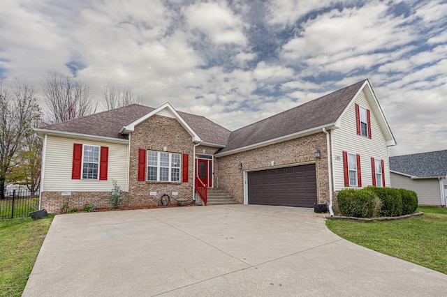 view of front of property featuring driveway, fence, a front yard, crawl space, and brick siding