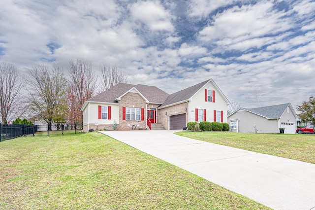 view of front of house with brick siding, an attached garage, fence, a front yard, and driveway