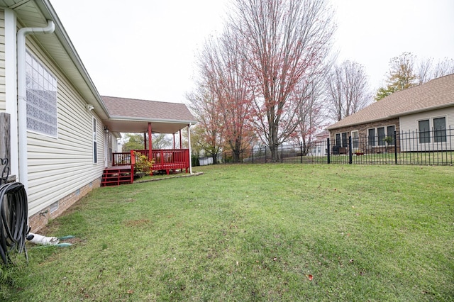 view of yard with a deck and a fenced backyard