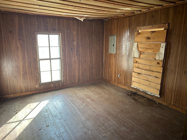 empty room featuring hardwood / wood-style flooring and electric panel