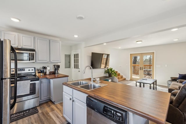 315B Bill Hunter Rd, Celina, TN 38551 - kitchen featuring a sink, wood counters, open floor plan, french doors, and appliances with stainless steel finishes