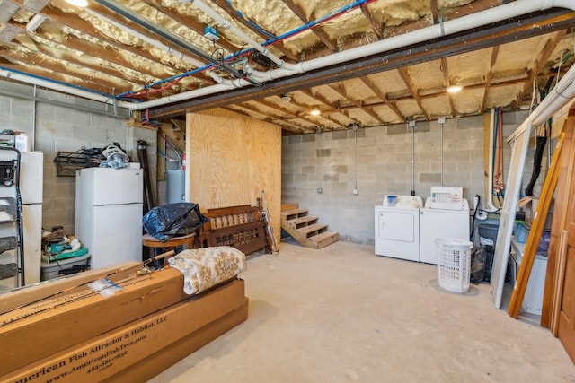 315B Bill Hunter Rd, Celina, TN 38551 - unfinished basement featuring gas water heater, freestanding refrigerator, and washing machine and clothes dryer