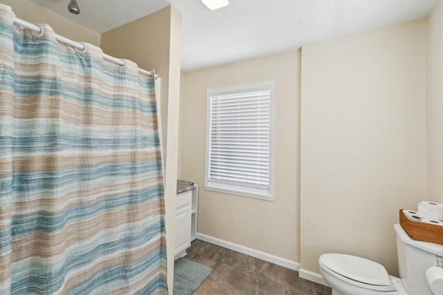 315B Bill Hunter Rd, Celina, TN 38551 - bathroom with toilet, a shower with shower curtain, and baseboards