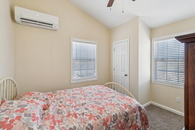 315B Bill Hunter Rd, Celina, TN 38551 - bedroom featuring a wall unit AC, baseboards, lofted ceiling, ceiling fan, and carpet flooring