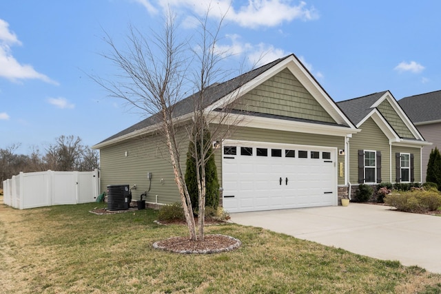 view of home's exterior featuring fence, an attached garage, concrete driveway, central air condition unit, and a lawn