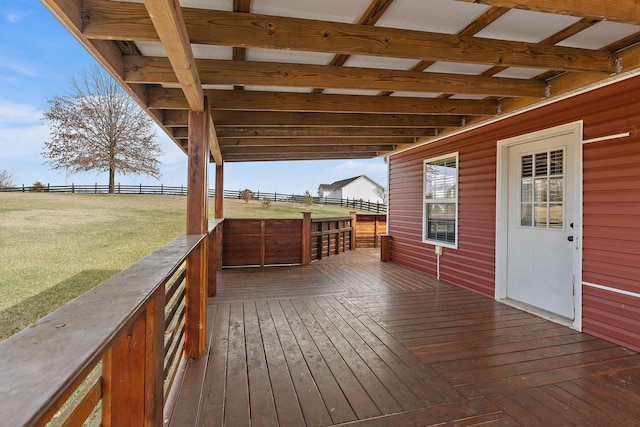 wooden deck featuring a yard and fence