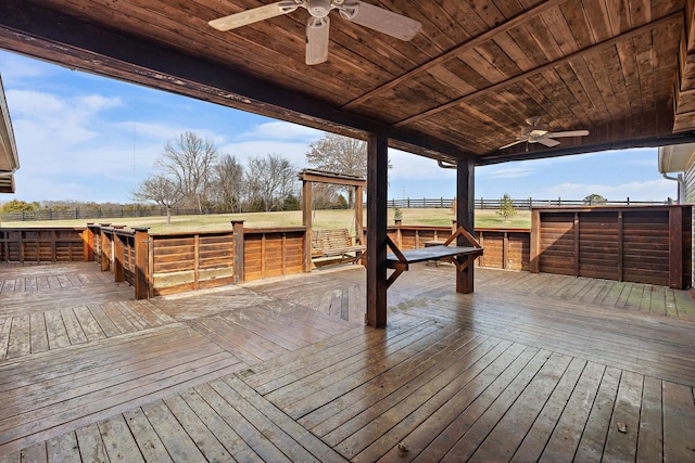 deck featuring a ceiling fan and fence