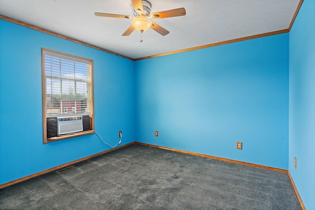 empty room with visible vents, ceiling fan, baseboards, ornamental molding, and dark colored carpet