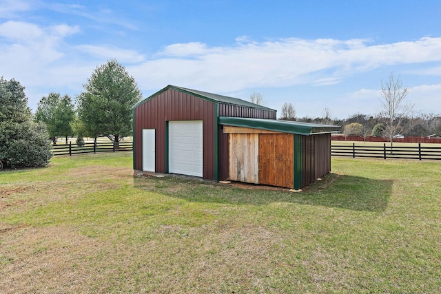 view of outdoor structure featuring an outbuilding and fence