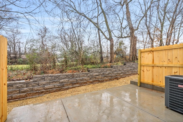 view of patio / terrace with fence and central AC