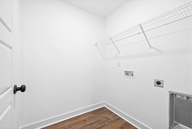 laundry area featuring baseboards, dark wood finished floors, washer hookup, laundry area, and hookup for an electric dryer