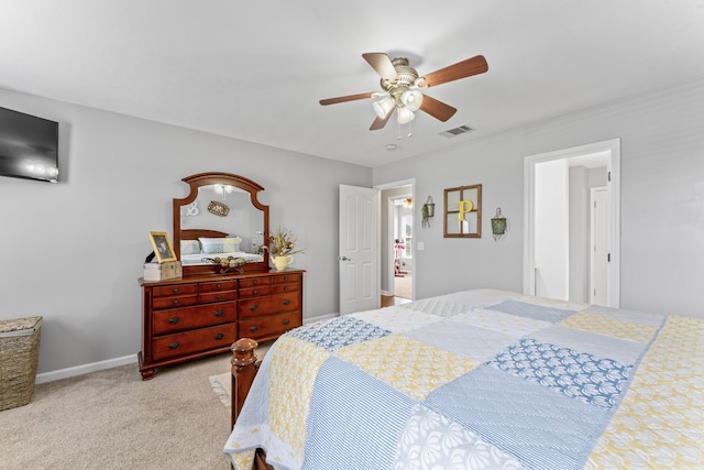 bedroom with visible vents, carpet floors, baseboards, and ceiling fan