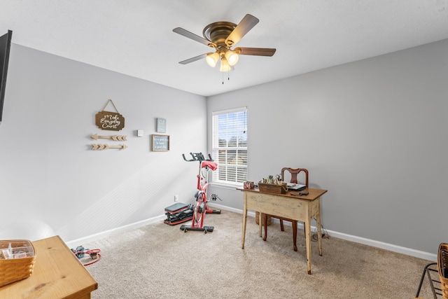 office area featuring carpet, baseboards, and ceiling fan