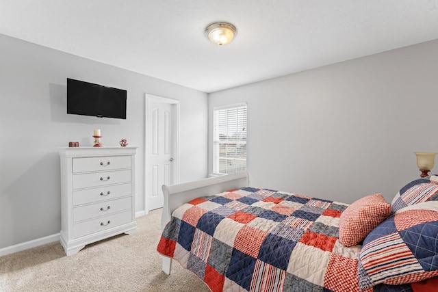 bedroom featuring baseboards and carpet floors