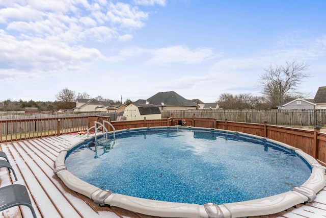 view of swimming pool featuring a fenced in pool and a fenced backyard