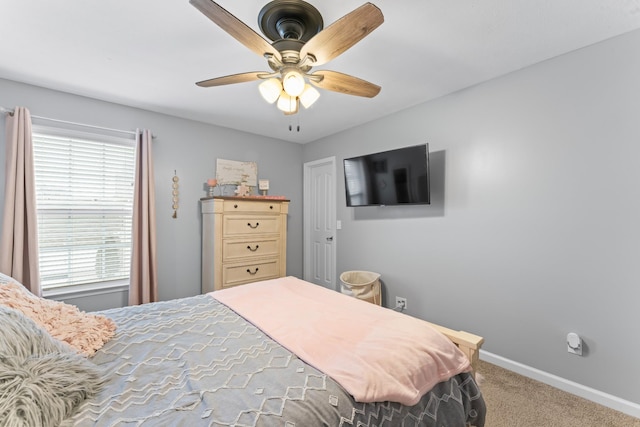 bedroom with baseboards, carpet floors, and ceiling fan