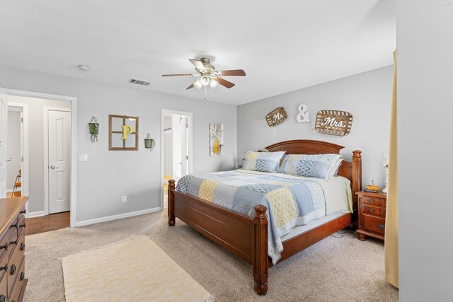 bedroom with visible vents, baseboards, ceiling fan, and carpet flooring