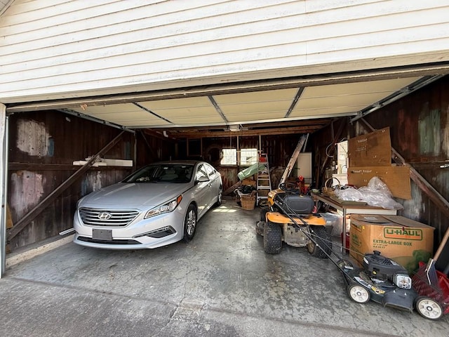 garage featuring wooden walls