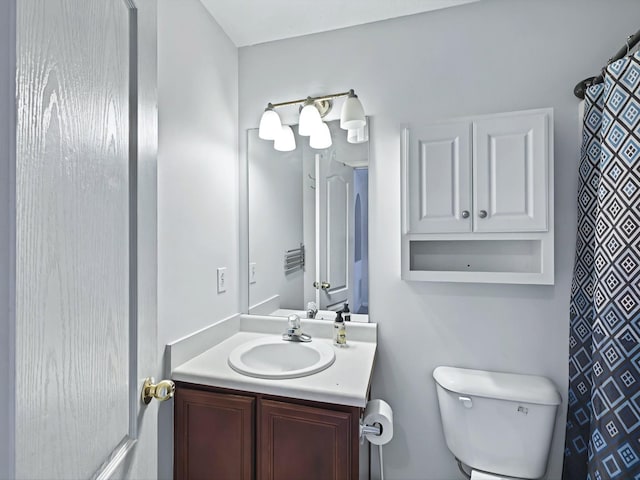 full bathroom with vanity and toilet