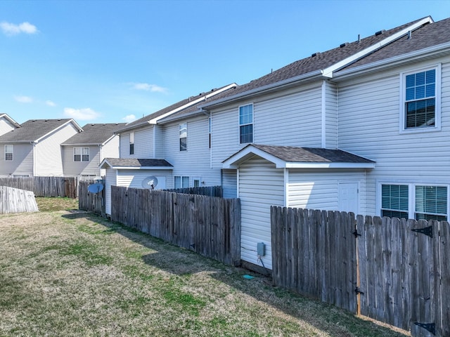 exterior space featuring a residential view and a fenced backyard