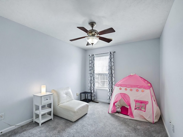 bedroom featuring baseboards, ceiling fan, and carpet flooring