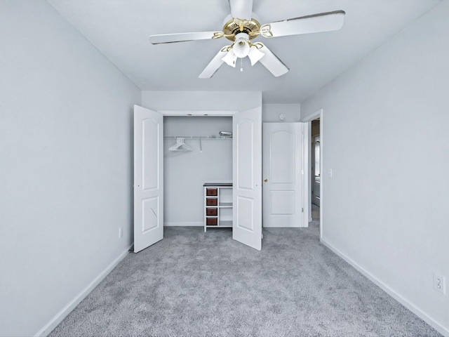 unfurnished bedroom featuring a closet, baseboards, carpet, and a ceiling fan