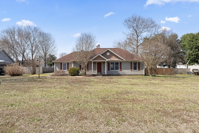 ranch-style home with a chimney, a front yard, and fence