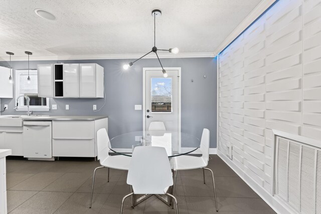 dining area with ornamental molding, baseboards, visible vents, and a textured ceiling