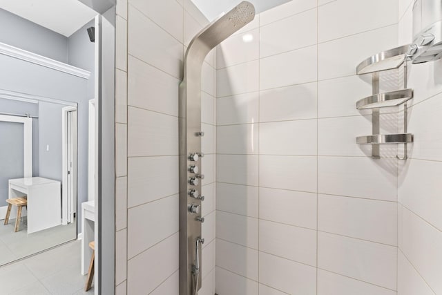 bathroom featuring tile patterned flooring and a shower stall