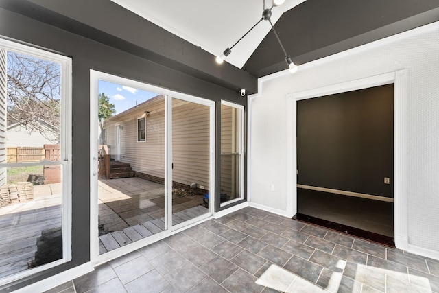 interior space featuring track lighting and plenty of natural light