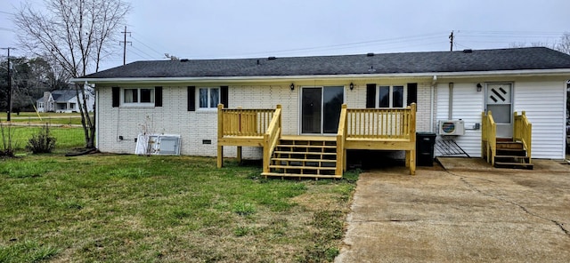 back of house featuring a deck, entry steps, a yard, crawl space, and brick siding