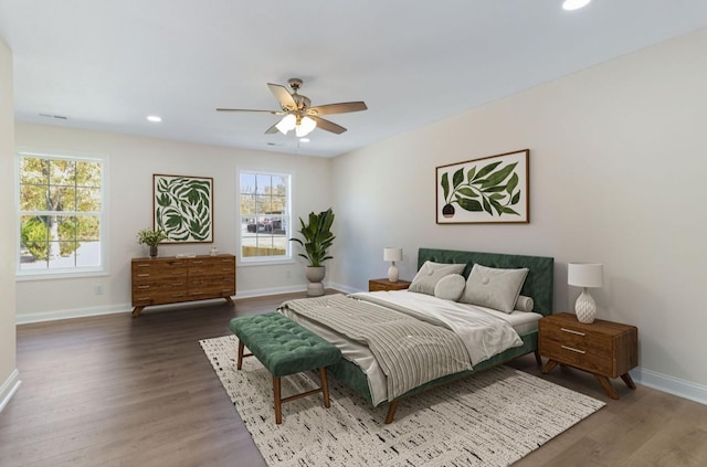 bedroom featuring recessed lighting, baseboards, wood finished floors, and a ceiling fan