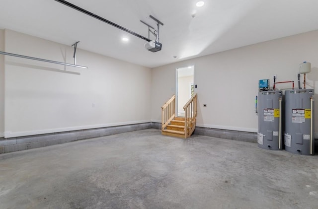 garage with a garage door opener and electric water heater