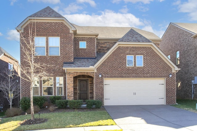 traditional-style home with a garage, stone siding, concrete driveway, and a shingled roof