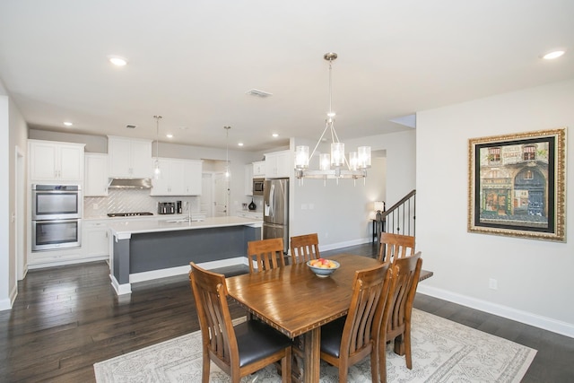 dining area with visible vents, baseboards, a chandelier, recessed lighting, and dark wood-style floors