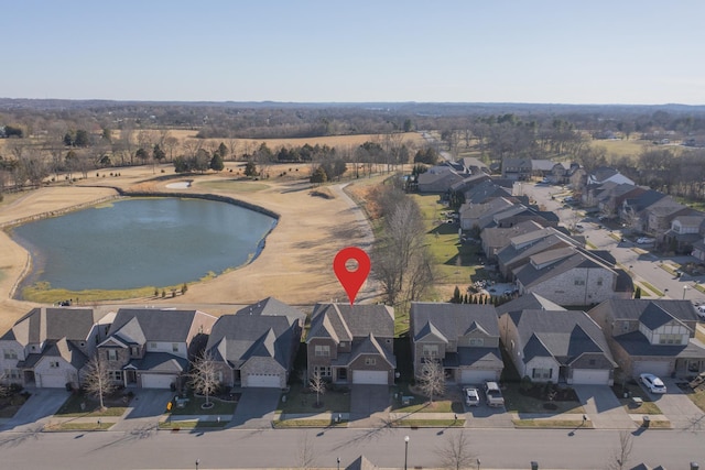 aerial view featuring a residential view and a water view