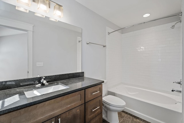 full bath with vanity, tile patterned floors, toilet, and shower / washtub combination