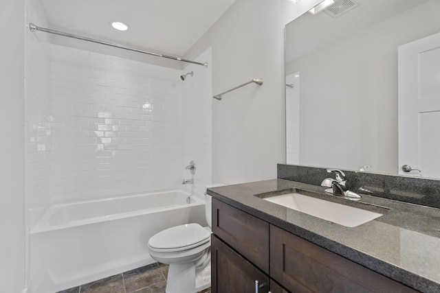 bathroom featuring visible vents, toilet, tile patterned flooring, tub / shower combination, and vanity