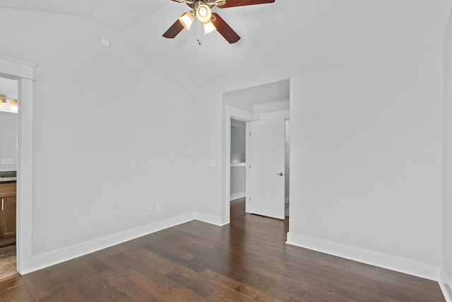 unfurnished room with ceiling fan, dark wood-type flooring, baseboards, and vaulted ceiling