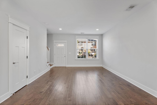 entryway featuring visible vents, dark wood-style flooring, recessed lighting, baseboards, and stairs