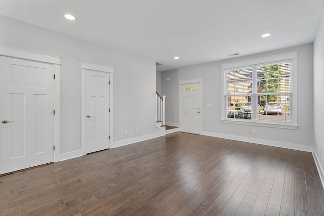 interior space with recessed lighting, stairs, and dark wood-type flooring